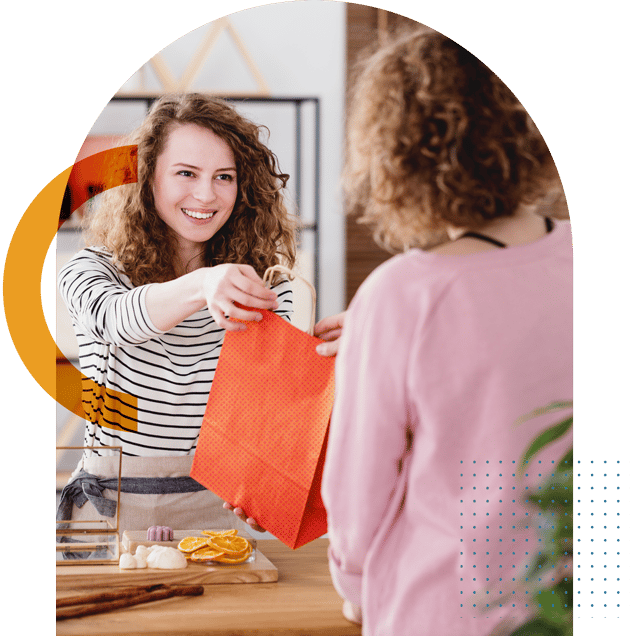 health store handing bag to customer COLOURED